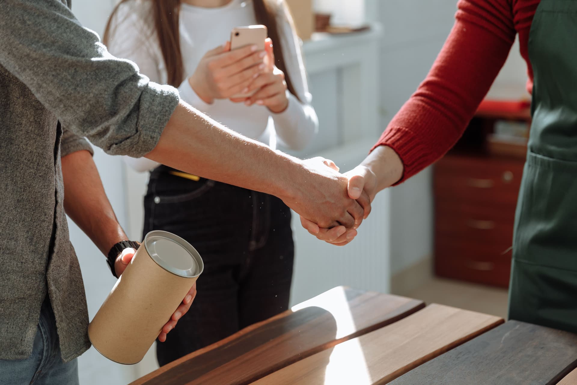 Warm handshake/office teamwork